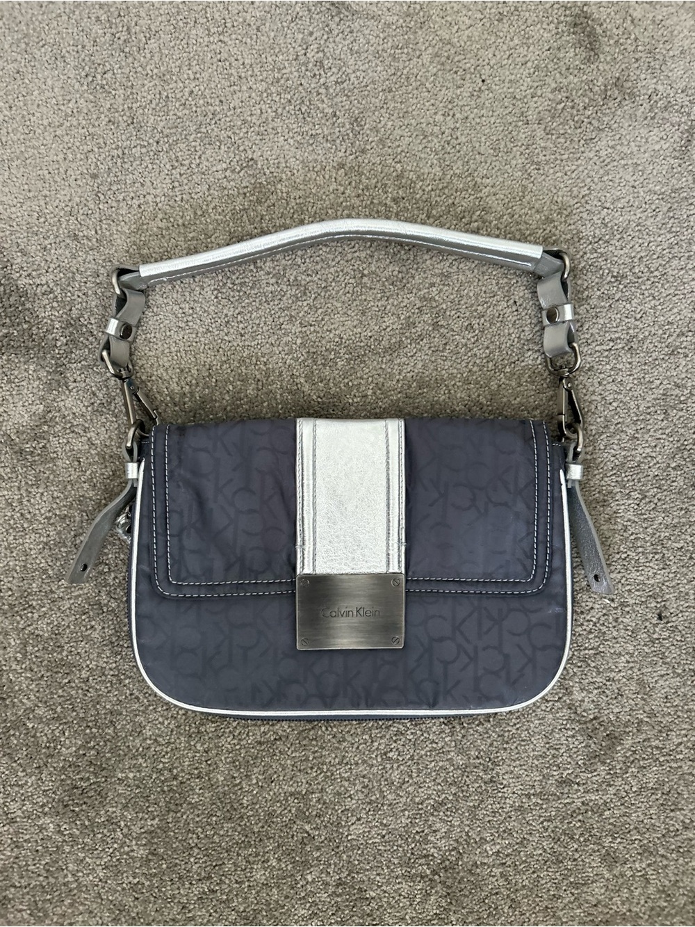 Calvin Klein navy shoulder bag with silver trim and logo plate